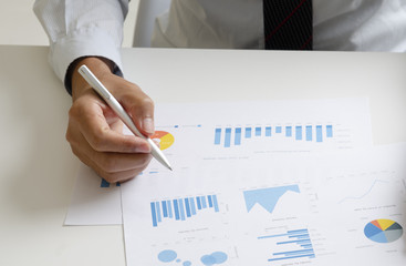 Businessman analyzing financial paperwork