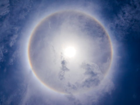 sun halo phenomenon on blue sky