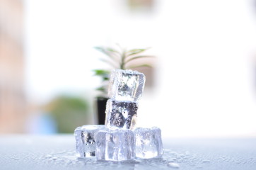 Ice view on gray tablecloth, the background is white light blur.