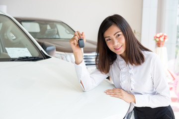 Young Happy Woman Showing The Key Of her New Car, Dream comes true concept, Asian sales woman with casual suit © pongsakorn_jun26