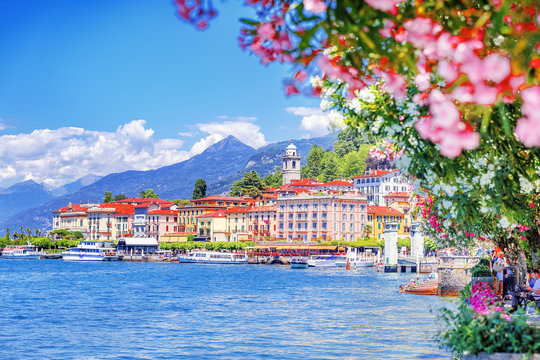 Lake Como, town Bellagio, Italy. Fascinating scenery of coastal town in famous and popular luxury summer resort - lake Como. Boat ferry in the distance.