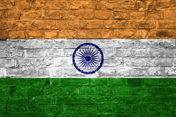 Fototapeta na wymiar Flag of India over an old brick wall background, surface
