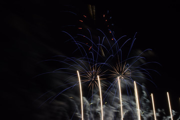 fireworks draws fine lines in the night sky, firework display for celebration by night