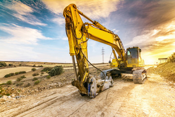 Hydraulic hammer working on road expansion works