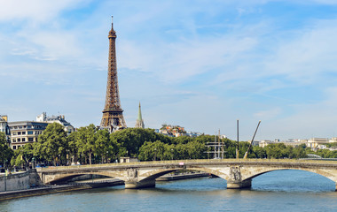 Eiffel Tower iconic landmark of Paris and pont des invalides bridge over the river Seine