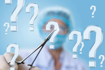 A doctor in the clamp holding the question mark .