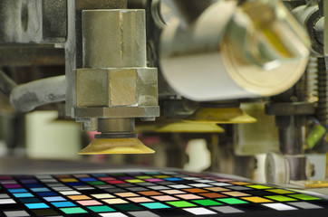 offset machine press print run at table; color patch detail