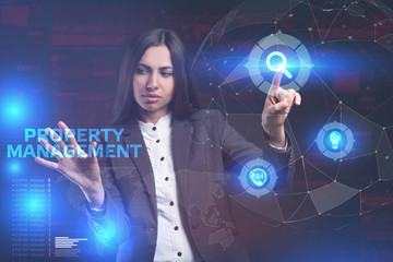 The concept of business, technology, the Internet and the network. A young entrepreneur working on a virtual screen of the future and sees the inscription: Property management