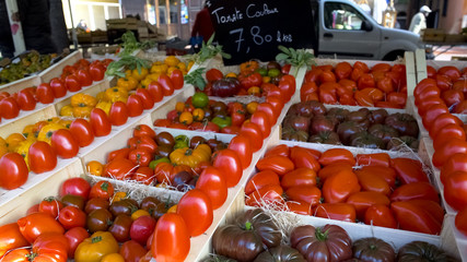 Fresh organic tomatoes on local vegetable market, healthy nutrition, trade