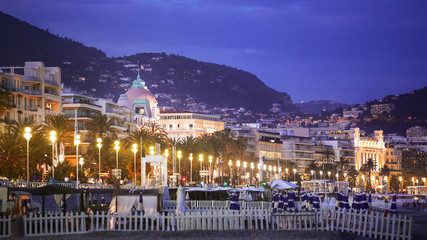 Fototapeta na wymiar Night view of illuminated Promenade des Anglais in Nice, vacation in France
