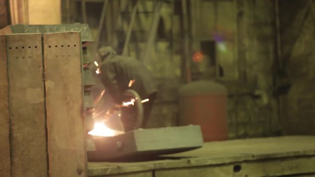 The welder works in the workplace. Gas welding flares.