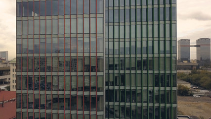 Fototapeta na wymiar Aerial view glass building. Glass window skyscraper building