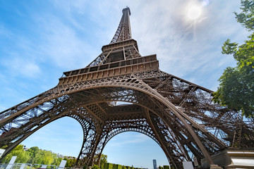 Fototapeta na wymiar Post card of iconic landmark Eiffel tower in Paris against spring blue sky