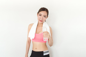 Fototapeta na wymiar Exercise concept. Athletes are tired of exercising. Beautiful girl drinking water after exercise.