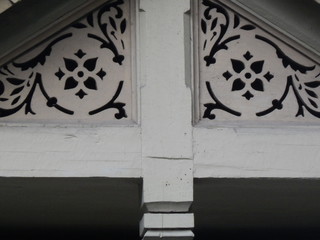 Fragment of a beautiful old wooden summer house with carvings