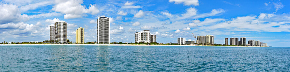 Fototapeta na wymiar The Ocean Mall and the upscale condominiums of Singer Island, Florida, with oceanfront views and direct beach access.
