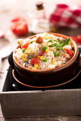 Traditional italian rice salad on wood table