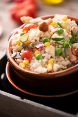Traditional italian rice salad on wood table
