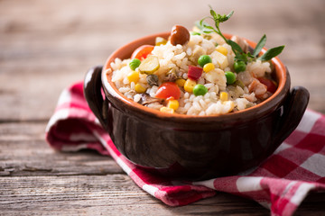 Traditional italian rice salad on wood table
