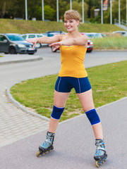 Young woman rollerblading outdoor on sunny day