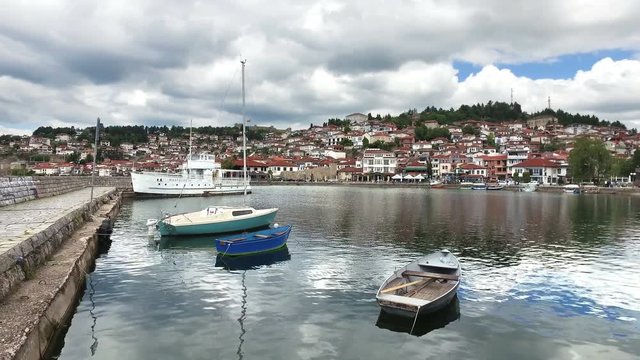 Ohrid lake. Fishing boats on port with the view of an old town of Ohrid in the background