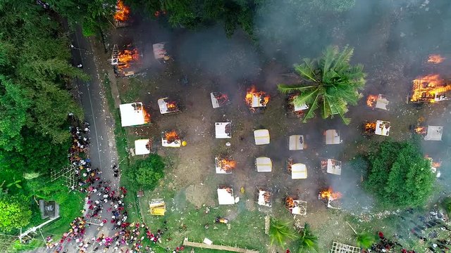 Aerial view hindu сremation ceremony on Bali. Human remains are burned in animal figures.