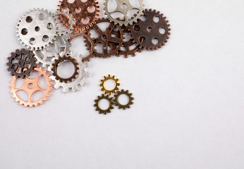 Different sizes and colored gears on a white background. Abstracts of business, education and knowledge concept