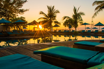 Sunset at the beach of Gili Trawangan with colorful sky and sunbeds, the paradise island, Gili, Bali Lombok in Indonesia