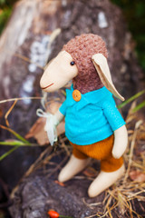 textile handmade sheep in blue shirt