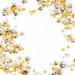 Gold and silver Jingle bells Christmas background. Flat lay,  top view