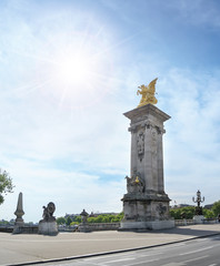 Fototapeta na wymiar Gold statue at Alexander III bridge in Paris