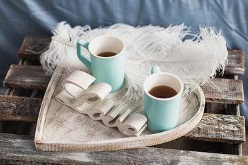 cup of coffee and cookies on wooden table