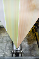 Close up of an offset roll printing machine during production, folding unit