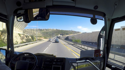 Bus driving pov on Highway road in Israel of Jerusalem/Highway road in Israel/flint5 - obrazy, fototapety, plakaty