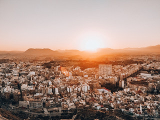 Fototapeta premium Sunset over Alicante city with mountains in the background