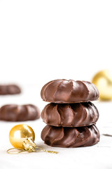 Three dark chocolate-coated zefir top view isolated on white background airy with christmas ornaments