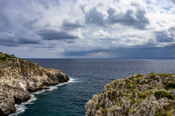 sea ​​on a rainy day at the bridge of Ciolo