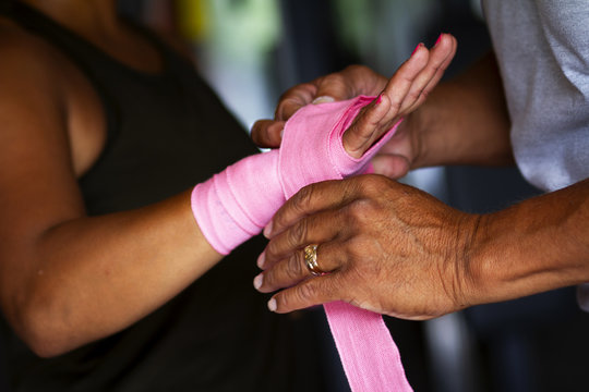 Latina Fitness Model Boxing in the Gym, Hand wrapping 