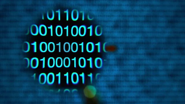 Magnifying glass moving left to right over computer screen with blue matrix style zeros and ones. Word ltc written in red letters in code line.