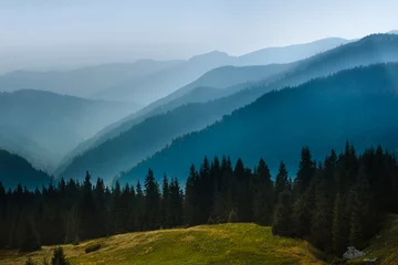 Fotobehang Majestic landscape of summer mountains. A view of the misty slopes of the mountains in the distance. Travel background.  © vovik_mar