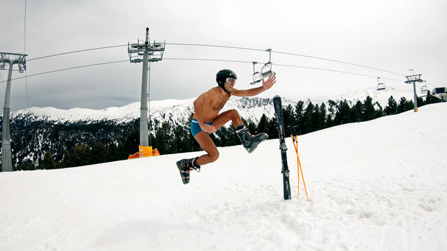 Happy Nude Male Have Fun Jump and Dance at Day Ski Slope Music Party
