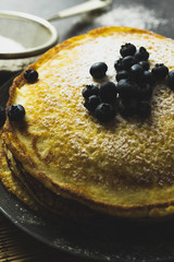 Sweet pancakes with honey and blueberry.