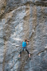 Naklejka na ściany i meble The climber is training to climb the rock.