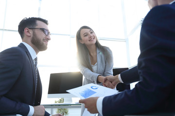 business woman and investor with a handshake.