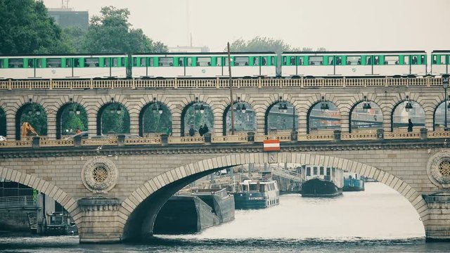 Line 6 subway on a Ponde de Bercy bridge over Seine in Paris, France