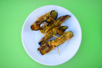 Fried eggplants rolled up with shrimps inside