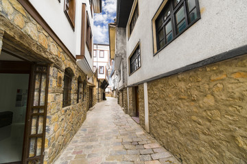 Fototapeta na wymiar Ohrid - Macedonia. Street alley in Old town of Ohrid with traditional houses