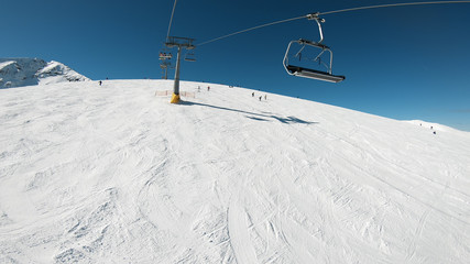 POV of the cable car lifts the peoples up to the slope