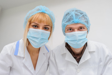 Doctors with masck  in a medical office