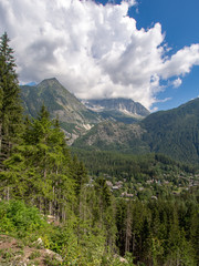 Hiking, trekking train path near Chamonix Mont BLanc, Haute Savoie, France in summer. View to the Alps from the petit balcon sud - the small south trail.